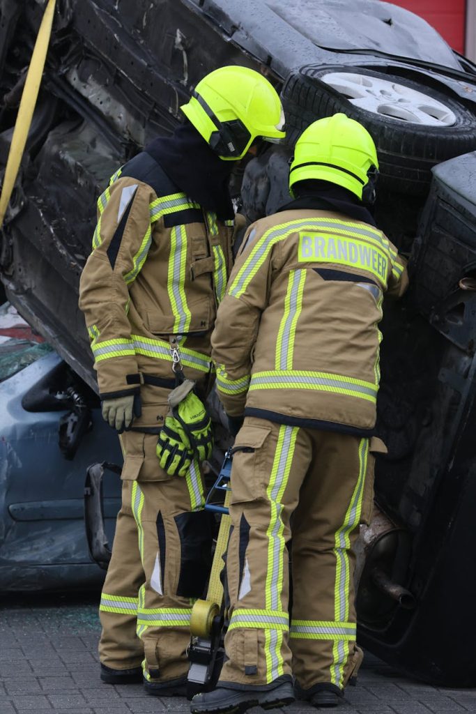firefighters assessing car accident scene