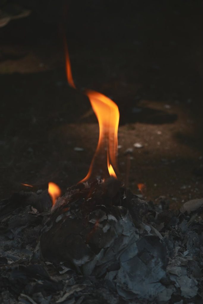 close up of flickering flame on ashes